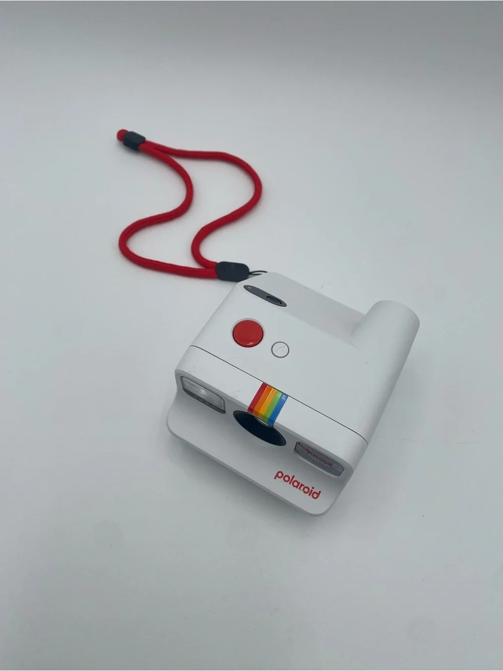 Polaroid White Instant Camera with Red Accent and Rainbow Stripe